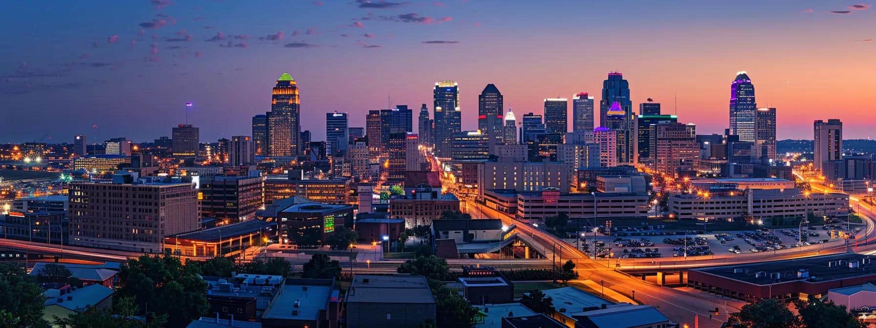 a dynamic kansas city skyline at dusk, illuminated by vibrant city lights, symbolizing the transformative power of swipeclock's seamless time tracking solutions for efficient workforce management.